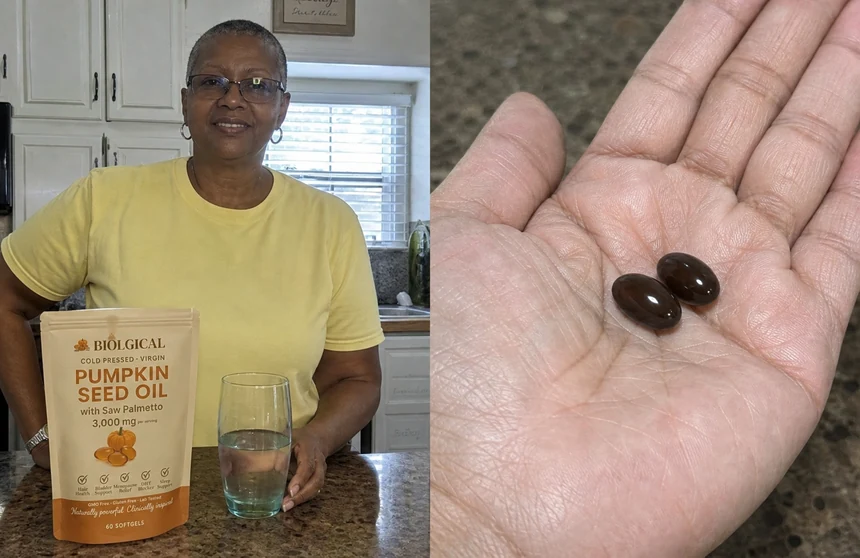 Two softgels in the palm of a hand, the daily serving